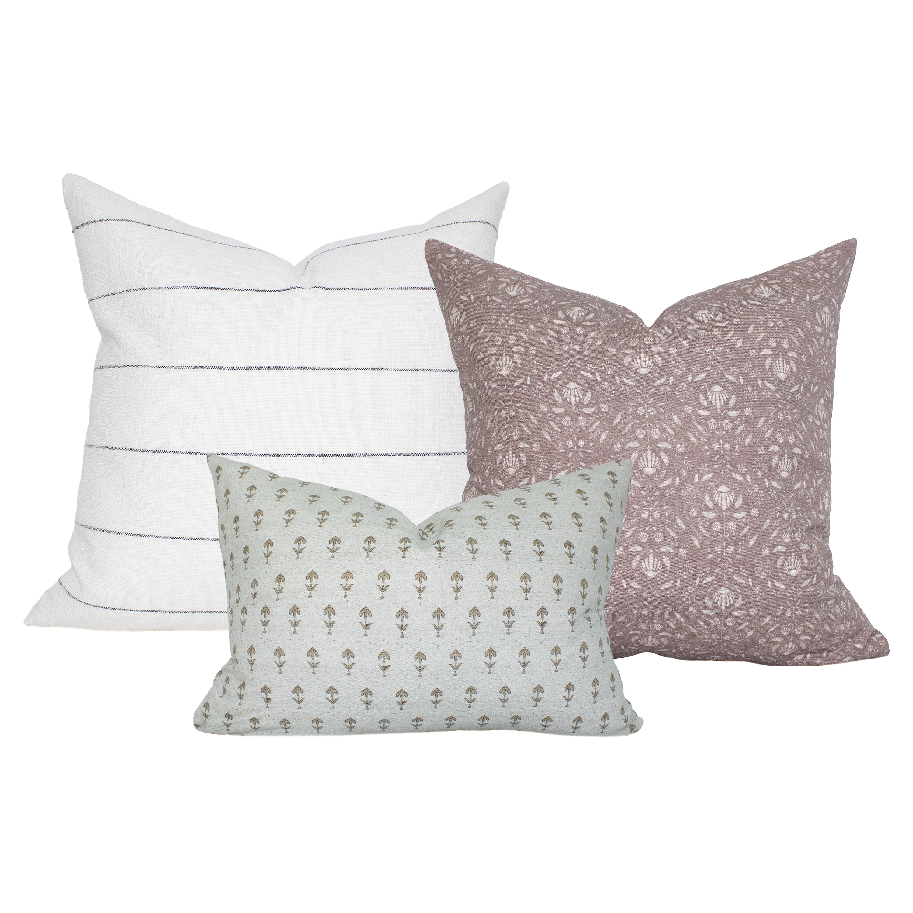 Three decorative pillows with different patterns on a white background