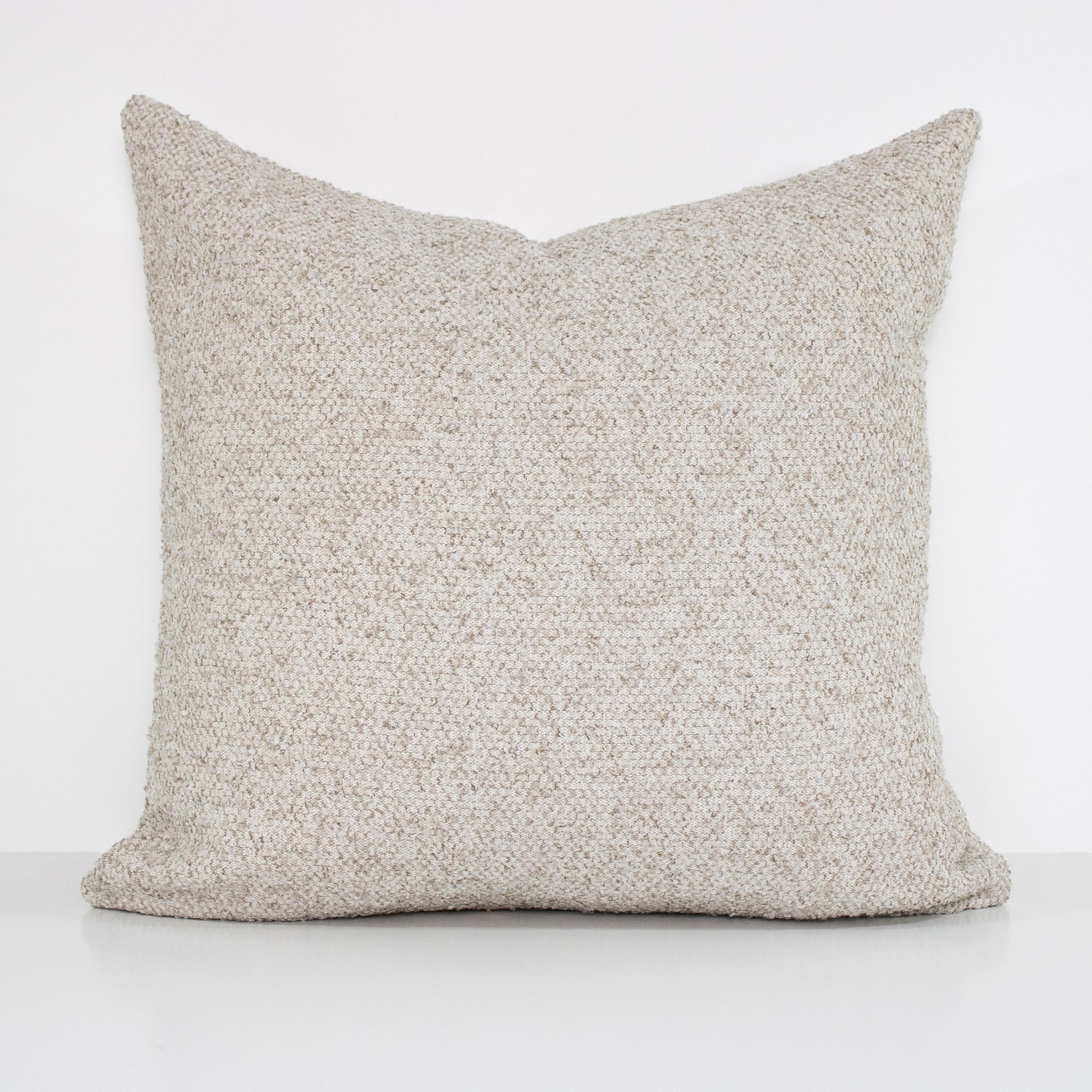 Textured gray pillow on a white background