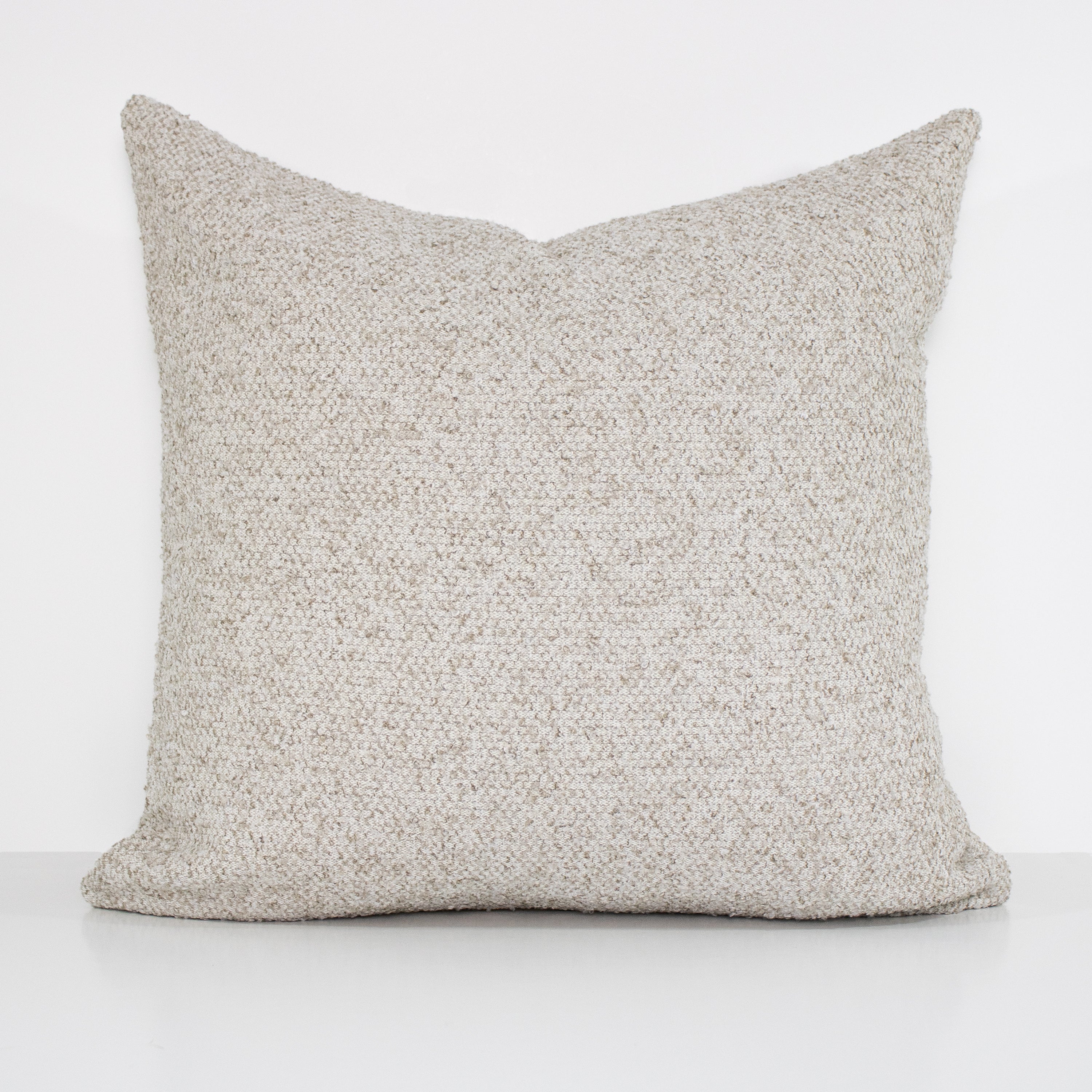 Textured gray pillow on a white background